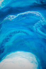 Part of original resin art epoxy resin painting. High quality details. Marble texture. Fluid art for modern banners, ethereal graphic design. Abstract ethereal bronze, blue and white swirl.