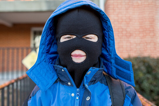 Young Boy In Ski Mask And Winter Coat