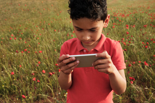 Boy Playing With Cell Phone