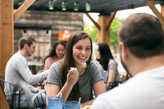 Dining: Woman Takes Bite Of Salad While On Date