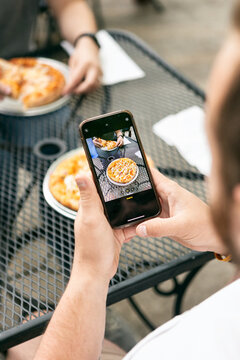Dining: Man Takes Photo Of Pizza At Lunch