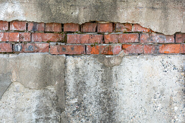 Background and texture of brick wall and plaster. Old brick wall with fallen off plaster. Background for design.