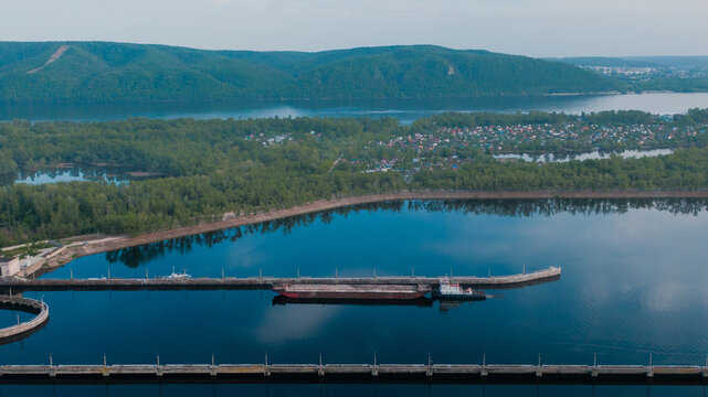 From above view of a barge ship passing by the gateway