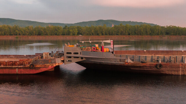 Tugboat pushing the barge ship