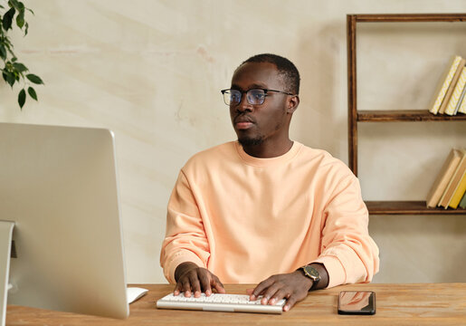 Black Man Working On Computer