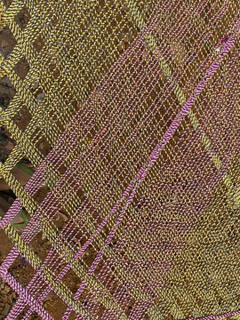 Colourful threads of a portable bed used by Indians
 