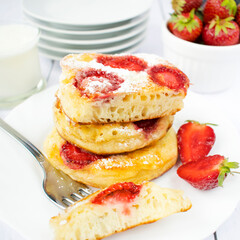 Homemade pancakes with yogurt and strawberries.