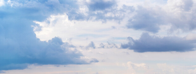 Dark blue clouds on the sunlit sky, panorama