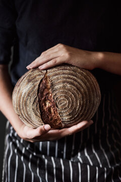Crop baker showing fresh bread