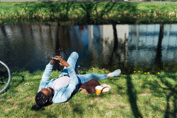 Black Man using A Mobile Outdoor