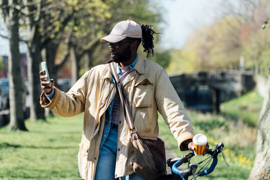 Happy Cyclist Drinking Takeaway Coffee