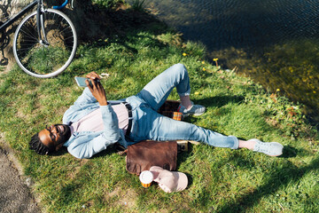 Black Man using A Mobile Outdoor