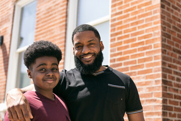 Smiling Father And Son In Urban Setting