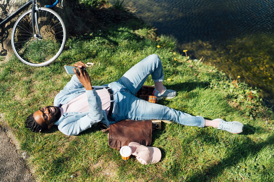 Black Man using A Mobile Outdoor