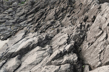 Rough rock on the coast cliff