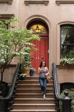 Woman Leaving Apartment Building