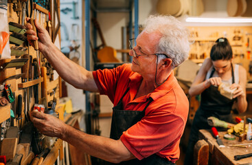 Senior guitar maker working in custom instrument