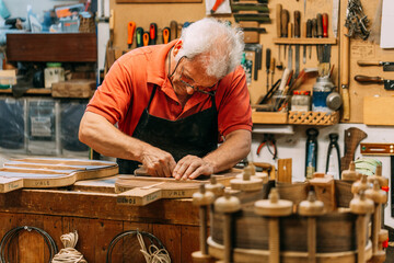 Senior guitar maker working in custom instrument
