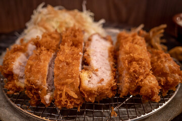 Selected focus at Tonkutsu menu, Japanese deep fried port serve with rice and Miso soup, on table in Japanese restaurant. 