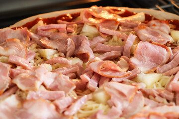 Homemade pizza topped with bacon and delicious.