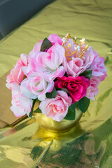 bouquet of pink flowers with a little crown on the top