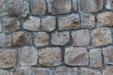 Masonry Rock Wall Texture. Texture of a stone wall. Part of old castle stone wall background.
