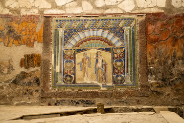 A Roman mosaic on a wall in the House of Neptune and Amphitrite. Ruins of ancient roman town...