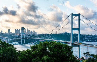 ISTANBUL, TURKEY. Panoramic view of Istanbul Bosphorus on sunset. Istanbul Bosphorus Bridge (15 July Martyrs Bridge. Turkish: 15 Temmuz Sehitler Koprusu). Beautiful cloudy blue sky..
