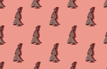 Pattern of christmas trees on pink pastel background