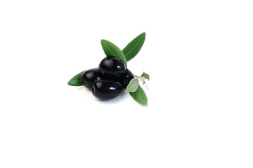 Green leaves with olives. Ripe black olives with leaves on a white background. 