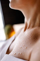 Close-up of a sweat drop in the sauna. Close-up skin after shower. Tanned body. Detox program in...