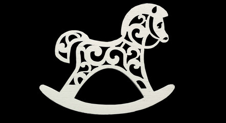 Wooden horse isolated on black background. Christmas Decorations from natural materials. Festive design elements for your project.