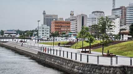 YOKOHAMA - AUG 19: View of modern buildings in Yokohama port, Japan on August 19, 2013. Yokohama is Japan's second largest city, the population is over 3 million nowadays.
