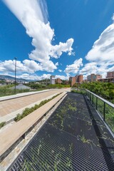 Medellin, Antioquia, Colombia. August 7, 2020: Cityscape in Parques Del Rio with beautiful blue sky.