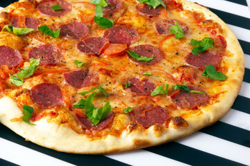 Pepperoni pizza with salami, mozzarella and tomatoes.