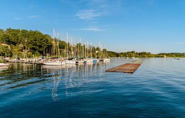 Fototapeta na wymiar Small tourist port Sasso Moro on Lake Maggiore, Leggiuno, Lombardy, Italy