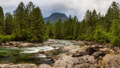 Panoramic View of the river in the Canadian Mountain Landscape. Cloudy Evening Sky. Golden Ears Provincial Park, near Vancouver, British Columbia, Canada.