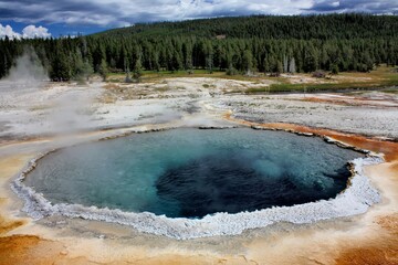 crested pool hot spring and orange microbial mat  at the old faithful geyser basin, yellowstone national park, wyoming