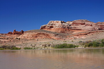 colorful eroded rock formations on a sunny day on the colorado river near moab, utah