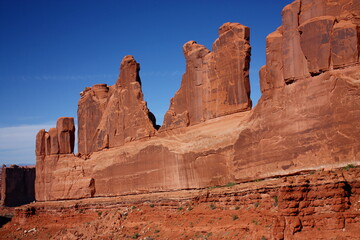 the incredible red rock formations of  park avenue on a sunny day  in arches national park, near...