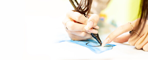 a person draws with a brush and paints on a large canvas in an art studio. creative, modern artist of fine art, a masterpiece of drawing, drawing training, art school, distance drawing courses, banner