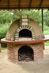 Clay oven to make homemade wholemeal bread, built with clay, stones and bricks
