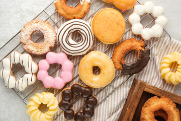 Many different donuts on a light background.