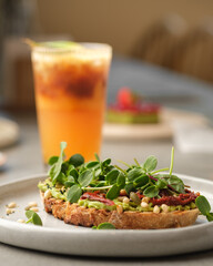 Bruschetta with avocado, herbs and seeds. Healthy wholesome food.