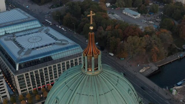 Panning aerial view of city park and buildings on riverbank. View from dome of Berlin Cathedral. Berlin, Germany.