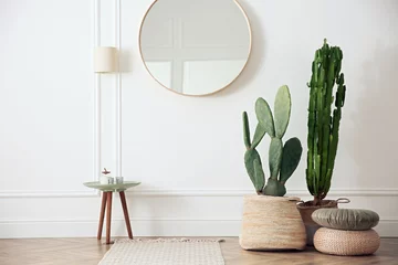 Poster Stylish room interior with beautiful potted cacti © New Africa
