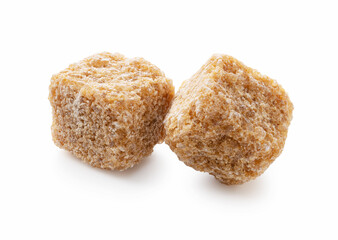 Brown sugar cubes placed on a white background.