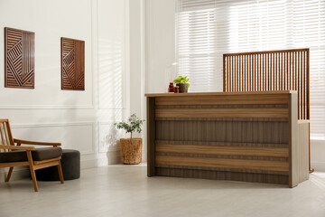 Hotel lobby interior with wooden reception desk. Stylish workplace