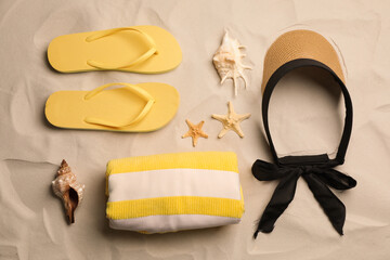Flat lay composition with beach objects on sand