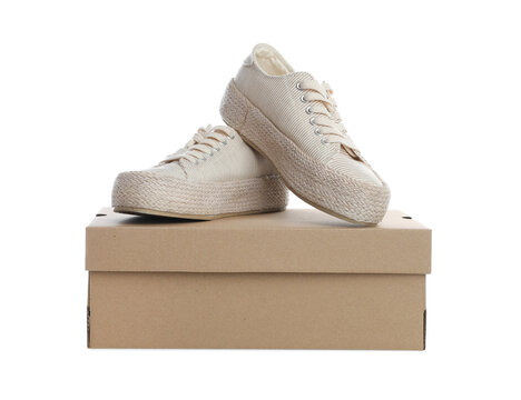 Pair of stylish sport shoes and cardboard box on white background Stock  Photo | Adobe Stock